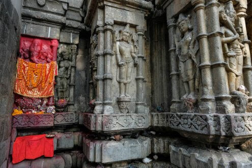 sculptures on a wall of temple in assam